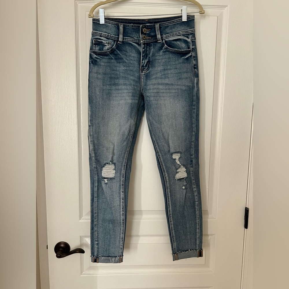 Mid rise skinny distressed jeans